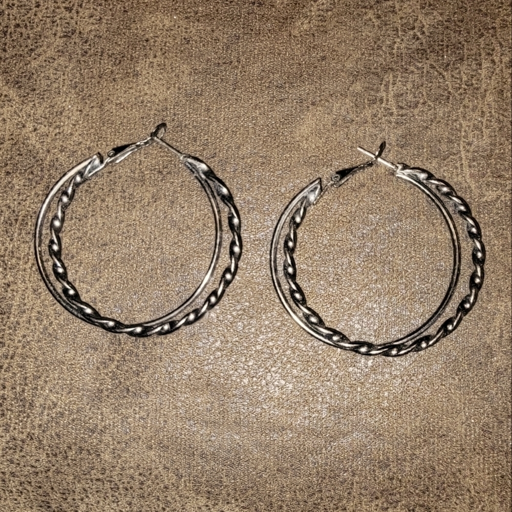 Bronze color hoop earrings with a twist hoop intertwined